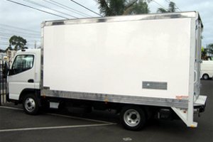 Rent a moving truck with tailgate lift and hand controller.